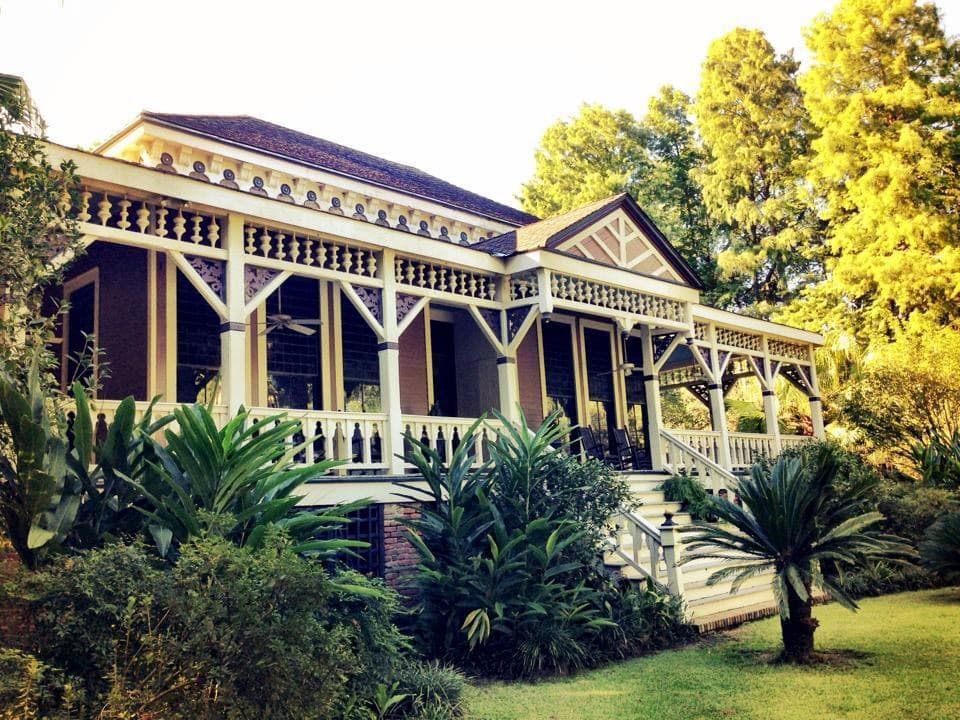 Poplar Grove today — the wraparound porch and brick foundation, surrounded by mature trees on the historic Mississippi River property.