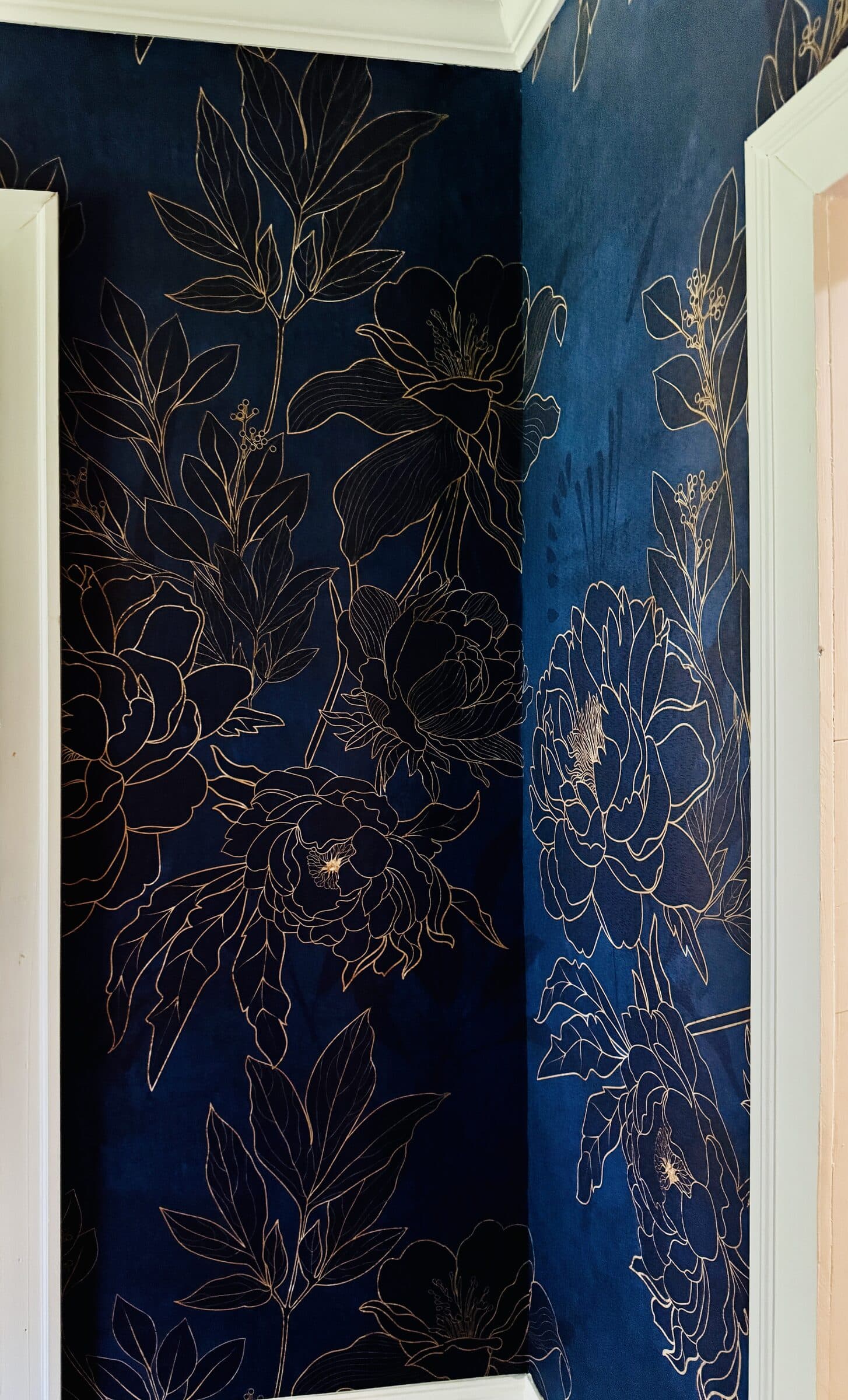 Navy and gold peony wallpaper hallway installation by Lauren Buckholtz