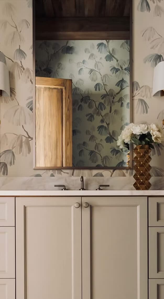Sage leaf wallpaper installation in a powder room by Lauren Buckholtz